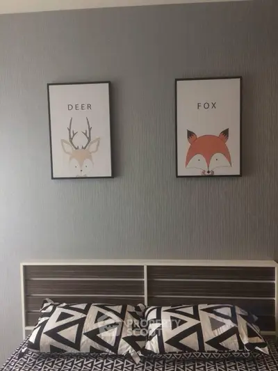 Stylish bedroom with modern decor and animal-themed wall art