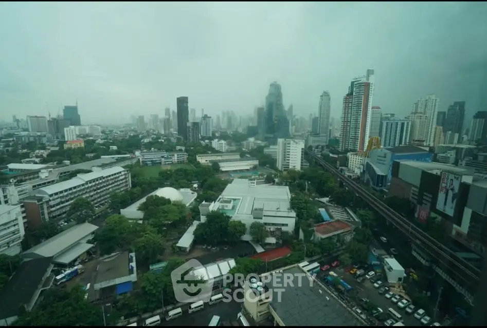 Stunning cityscape view showcasing a vibrant urban skyline with towering skyscrapers and lush greenery.