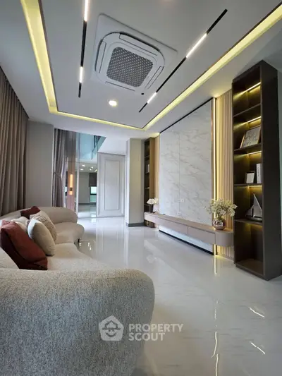 Luxurious modern living room with elegant lighting and plush furniture