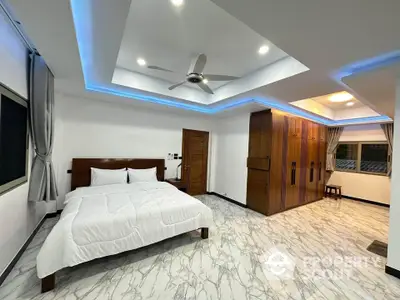 Spacious modern bedroom with elegant ceiling lights and marble flooring