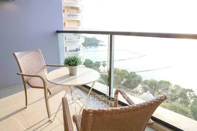 Stunning balcony with ocean view, perfect for relaxation and enjoying the sea breeze.