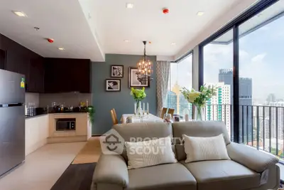 Modern living room with city view, open kitchen, and elegant decor in high-rise apartment.