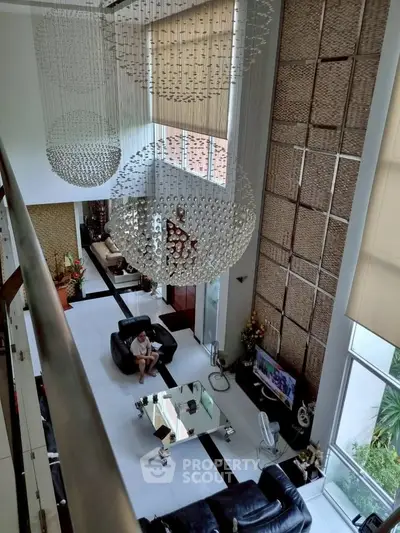 Luxurious modern living room with high ceilings and elegant decor