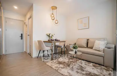 Modern living room with elegant decor and cozy dining area in a stylish apartment.