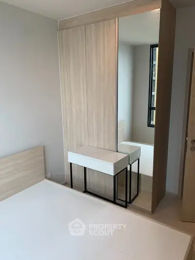 Modern bedroom with minimalist design and built-in wardrobe