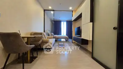 Modern open-plan living room with stylish furniture and natural light