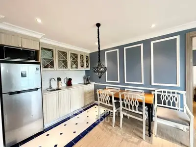 Chic modern kitchen with elegant dining area and stylish lighting