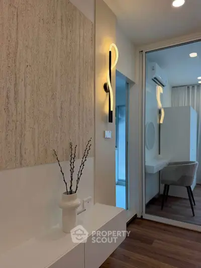 Modern interior with elegant wall light and stylish decor in a cozy living space.