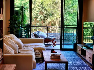 Chic living room with cozy sofa and lush balcony view, perfect for relaxation.