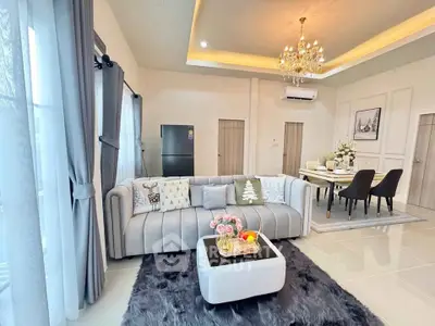 Luxurious living room with elegant chandelier and modern decor