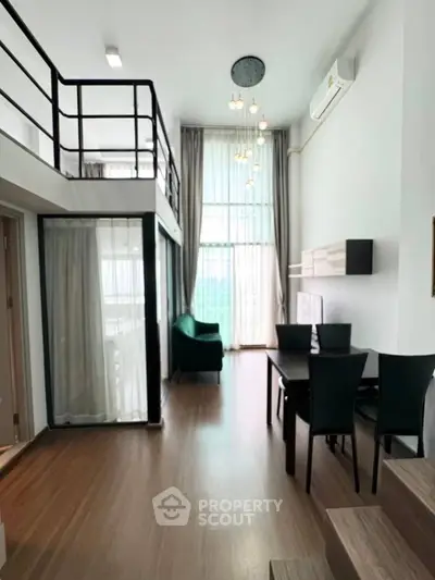 Modern loft-style living room with high ceilings and elegant decor