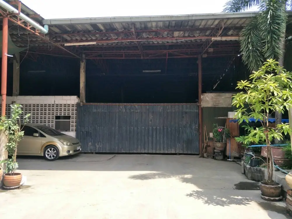 Spacious industrial warehouse with ample parking and greenery