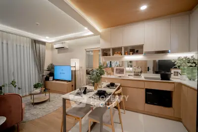 Modern open-layout kitchen and living room with stylish decor and dining area