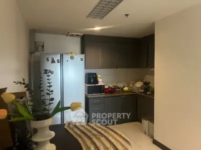 Cozy kitchen with modern appliances and ample storage space, perfect for culinary enthusiasts.