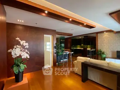 Luxurious living room with elegant wooden flooring and modern decor