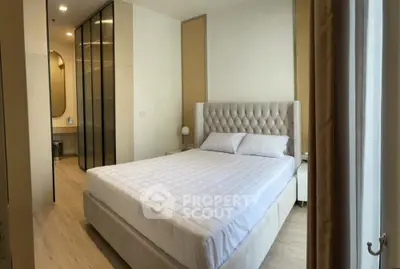 Luxurious bedroom with elegant decor and plush bed in modern apartment