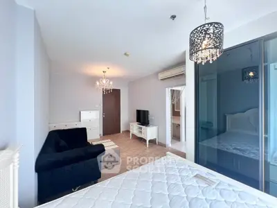 Spacious bedroom with elegant decor and modern amenities for luxurious living.