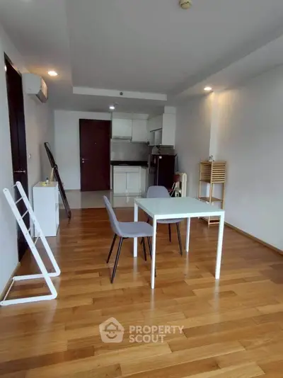 Modern minimalist apartment with open layout and wooden flooring