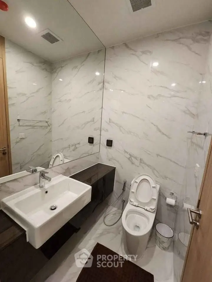 Modern bathroom with sleek design and marble walls