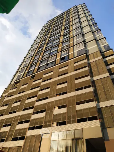Modern high-rise building with sleek architecture and expansive windows