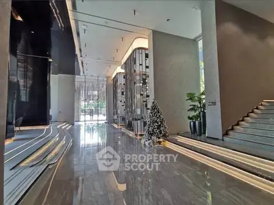 Luxurious modern building entrance with sleek design and elegant decor