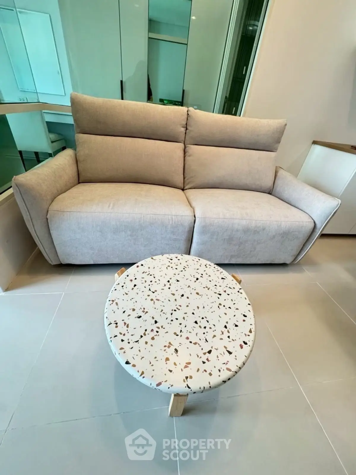 Modern living room with stylish sofa and terrazzo coffee table