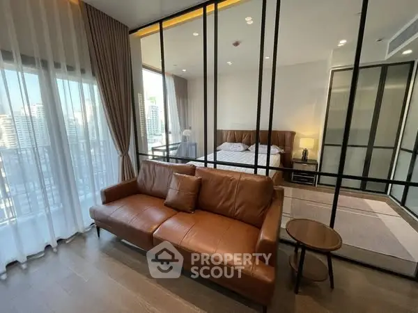 Modern studio apartment with glass partition and city view