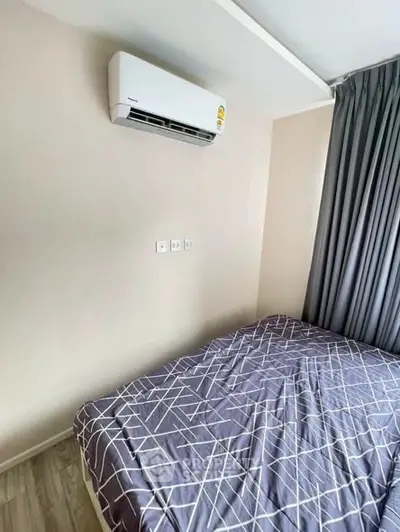 Cozy bedroom with air conditioning and modern decor in a stylish apartment.