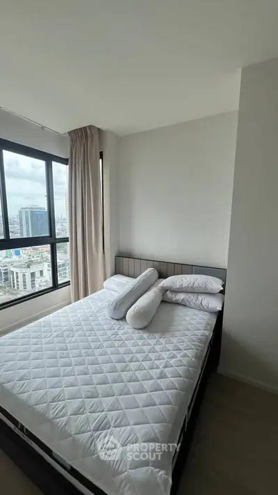 Modern bedroom with city view and cozy bed in high-rise apartment