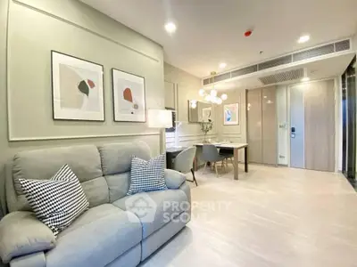 Modern living room with stylish decor and cozy seating in a contemporary apartment.