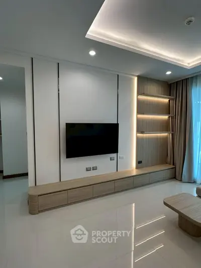 Modern living room with sleek TV unit and ambient lighting