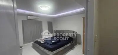 Modern bedroom with stylish bed and ambient lighting