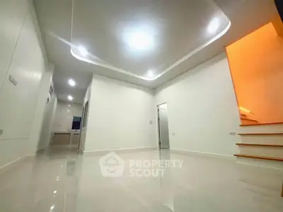 Spacious modern interior with sleek lighting and minimalist design, perfect for contemporary living.