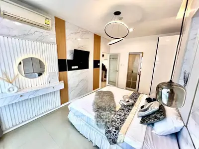 Luxurious modern bedroom with stylish decor and elegant lighting