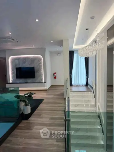 Luxurious modern interior with elegant lighting and sleek staircase design