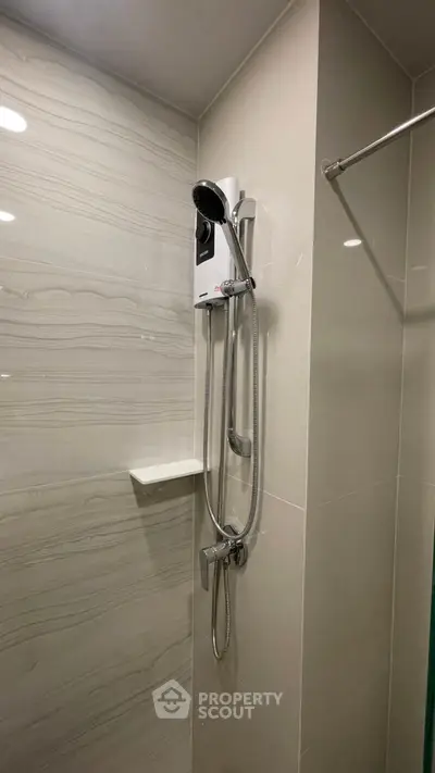 Modern bathroom with sleek shower and elegant tile design