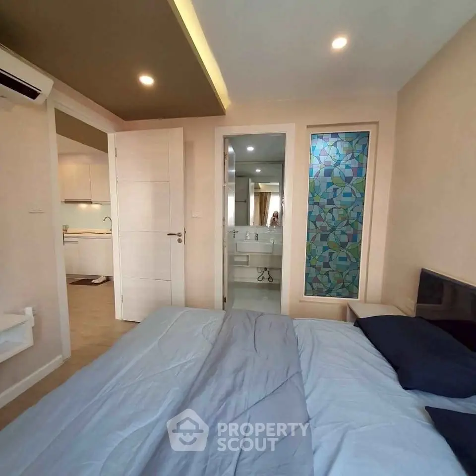 Modern bedroom with ensuite bathroom and stylish decor