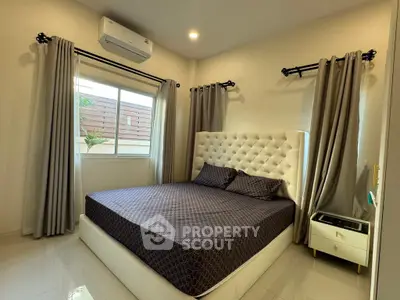 Modern bedroom with elegant decor and natural light