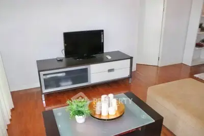 Modern living room with sleek TV stand and cozy seating area