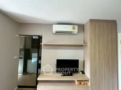 Modern living room with air conditioning and TV in stylish apartment