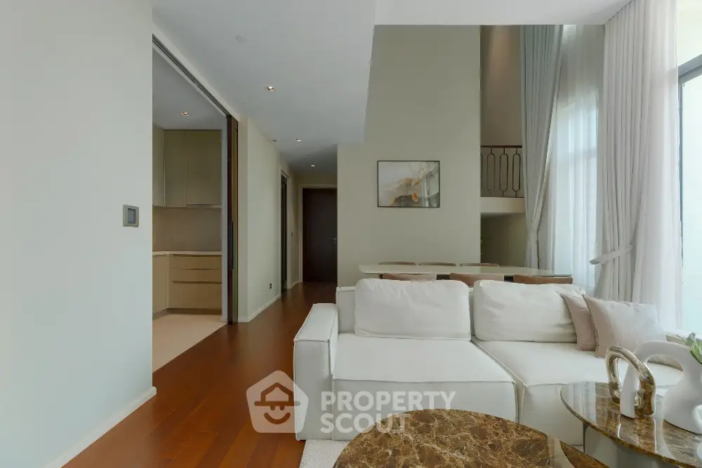 Luxurious modern living room with high ceilings and elegant decor