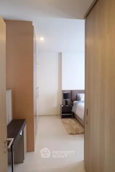 Modern bedroom with sleek wooden accents and cozy ambiance