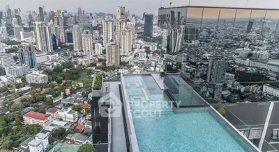 Stunning rooftop pool with panoramic city skyline views in luxury high-rise building.