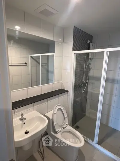 Modern bathroom with sleek shower and contemporary fixtures