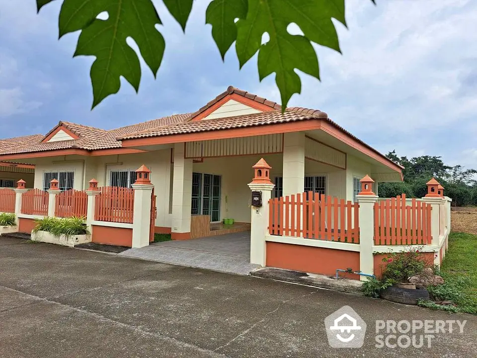 Charming single-story home with tiled roof and fenced yard in a serene neighborhood.