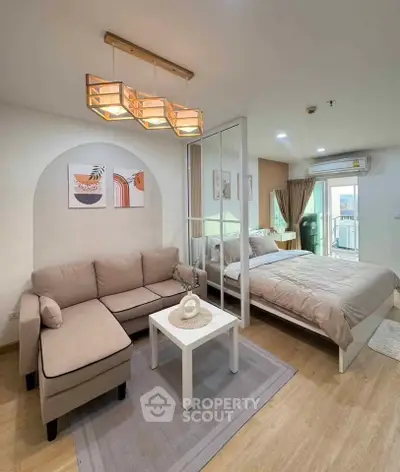Modern studio apartment with cozy living area and stylish decor