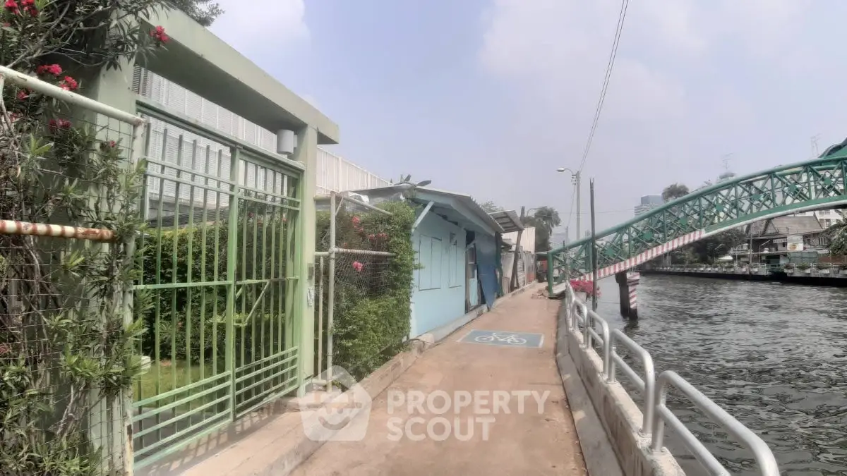 Charming riverside property with scenic views and nearby pedestrian bridge access.
