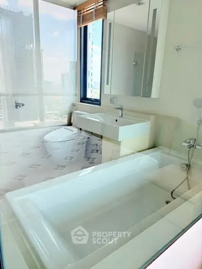 Luxurious bathroom with city view, featuring modern fixtures and a sleek bathtub.