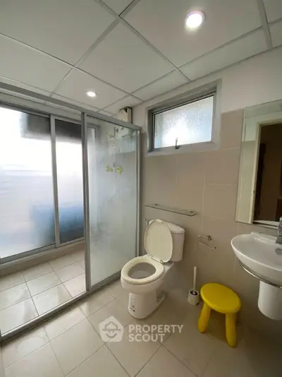 Modern bathroom with glass shower and sleek fixtures