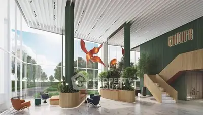 Luxurious modern building entrance with elegant design and lush greenery.